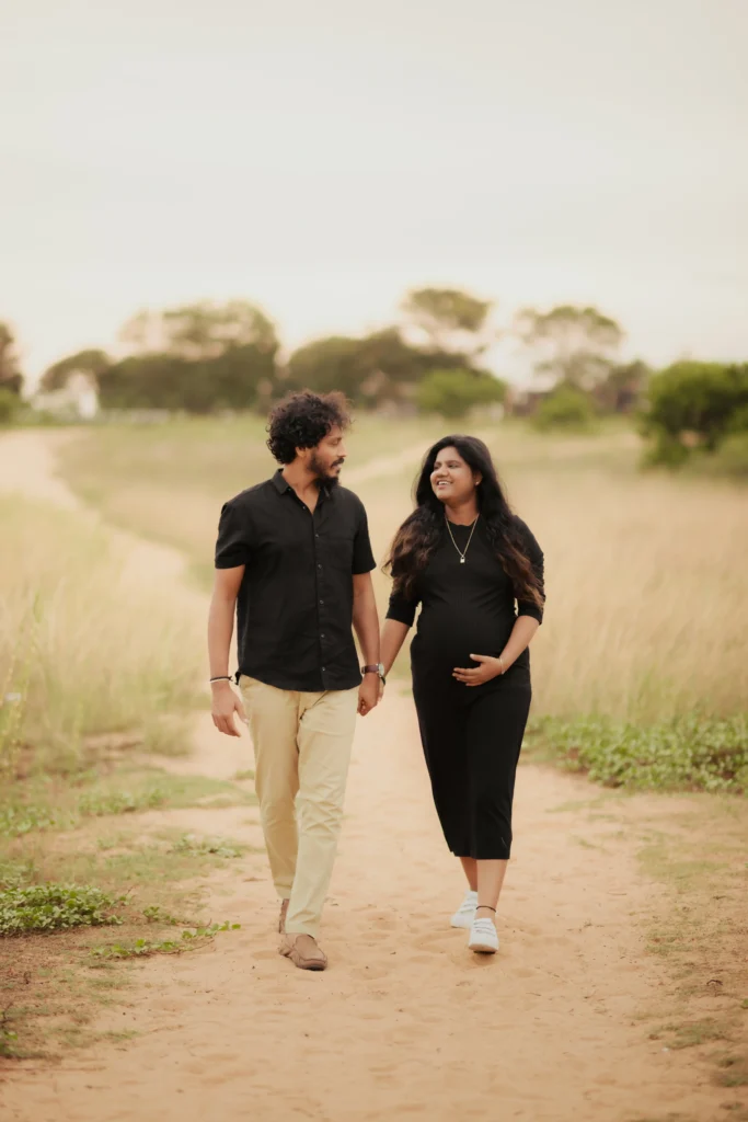 Stylish maternity outfits for photoshoot worn by a glowing pregnant woman indoors.